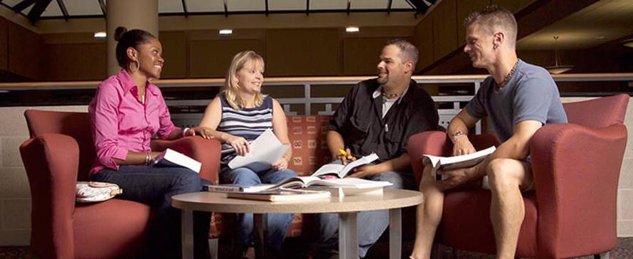 Students meeting with staff